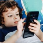 Baby boy using smartphone